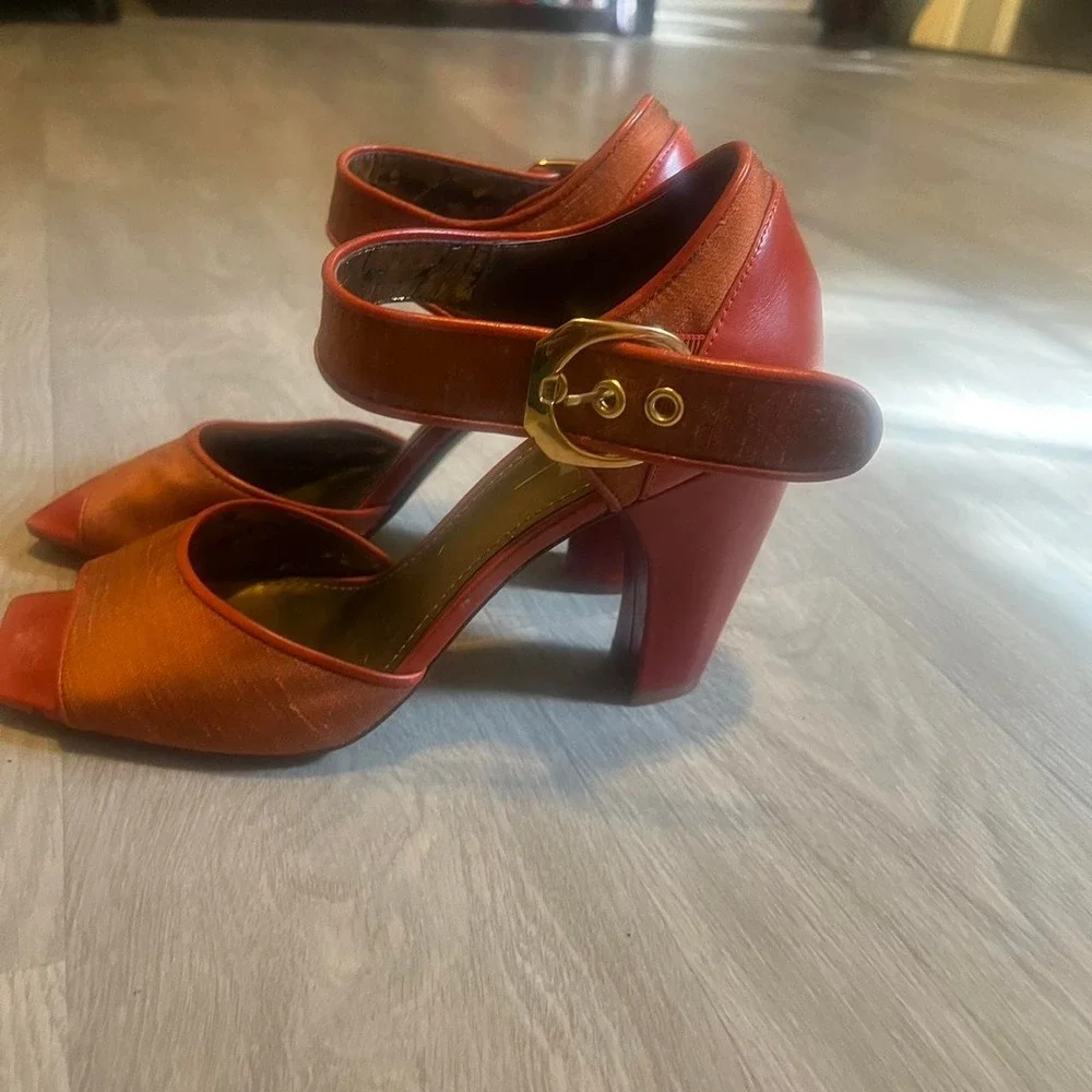 Paleo orange leather heels with gold buckle